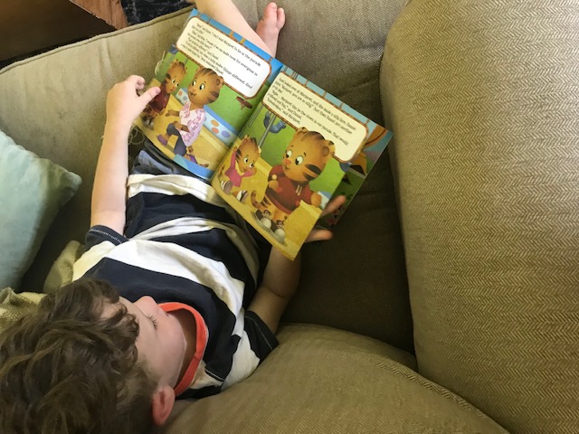 boy reading a book