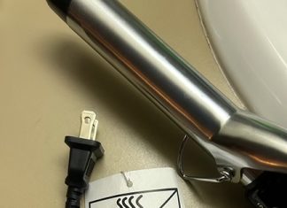 The great curling iron catostrophe a curling iron with a warning lable